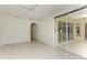 Gathering room with tile floors, ceiling fan and arched entryway at 7023 Chickasaw Bayou Rd, Bradenton, FL 34203