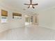 Gathering room with tile floors, ceiling fan and sliding doors at 7023 Chickasaw Bayou Rd, Bradenton, FL 34203