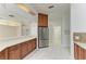 Spacious kitchen featuring stainless steel appliances and light wood cabinets at 7023 Chickasaw Bayou Rd, Bradenton, FL 34203