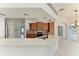 Modern kitchen with wood cabinets, quartz countertops and breakfast bar at 7023 Chickasaw Bayou Rd, Bradenton, FL 34203