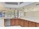 Kitchen island with sink and view of the pool at 7023 Chickasaw Bayou Rd, Bradenton, FL 34203
