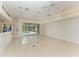 Open living area with tile flooring and access to the pool area at 7023 Chickasaw Bayou Rd, Bradenton, FL 34203