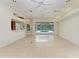 Spacious living room with a view of the pool and sliding glass doors at 7023 Chickasaw Bayou Rd, Bradenton, FL 34203