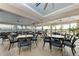 Community patio with tables and chairs overlooking a lake at 7023 Chickasaw Bayou Rd, Bradenton, FL 34203