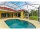 Spacious backyard with a screened pool at 7023 Chickasaw Bayou Rd, Bradenton, FL 34203