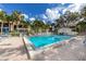 Inviting community pool with lounge chairs for soaking up the sun at 752 White Pine Tree Rd # 108, Venice, FL 34285