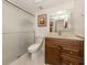 Clean bathroom with a shower/tub combo and wood vanity at 806 Capri Isles Blvd # 109, Venice, FL 34292