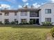 Two-story condo building with lush landscaping at 806 Capri Isles Blvd # 109, Venice, FL 34292