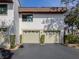 Two-car garage with automatic garage doors at 806 Capri Isles Blvd # 109, Venice, FL 34292