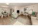 Open living space with dining area and seating at 806 Capri Isles Blvd # 109, Venice, FL 34292