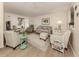 Living room with light beige couch and striped armchairs at 806 Capri Isles Blvd # 109, Venice, FL 34292