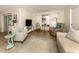 Living area with comfy seating and view to the outdoors at 806 Capri Isles Blvd # 109, Venice, FL 34292