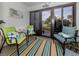 Relaxing sunroom with access to the patio and view of the community at 806 Capri Isles Blvd # 109, Venice, FL 34292