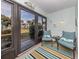 Bright sunroom with comfy seating and view of the grounds at 806 Capri Isles Blvd # 109, Venice, FL 34292