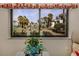 Peaceful view of a pond and lush landscaping from the window at 806 Capri Isles Blvd # 109, Venice, FL 34292