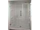 Bathroom with a large glass shower enclosure at 808 S Green Cir, Venice, FL 34285