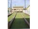Landscaped bocce ball court with benches at 808 S Green Cir, Venice, FL 34285