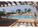 Relaxing community pool with plenty of lounge chairs and shade at 808 S Green Cir, Venice, FL 34285