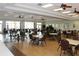 Large community room with many tables and chairs at 808 S Green Cir, Venice, FL 34285