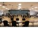 Large community room with stage and seating at 808 S Green Cir, Venice, FL 34285