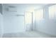 Bright laundry room with white walls and door at 808 S Green Cir, Venice, FL 34285