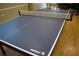 Indoor ping pong table with net, ready for play at 808 S Green Cir, Venice, FL 34285