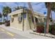 Tan building housing the sales and rental office of a waterfront community at 808 S Green Cir, Venice, FL 34285