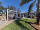 Large backyard with a pool, hot tub, and screened enclosure at 809 Garland Ave, Nokomis, FL 34275