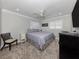 Bright bedroom with a ceiling fan and ample closet space at 809 Garland Ave, Nokomis, FL 34275
