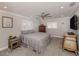 Spacious bedroom with ceiling fan, large windows, and plush carpeting at 809 Garland Ave, Nokomis, FL 34275