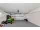 Spacious garage with overhead storage and room for equipment at 809 Garland Ave, Nokomis, FL 34275