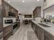 Modern kitchen with stainless steel appliances and white countertops at 809 Garland Ave, Nokomis, FL 34275