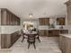 Modern kitchen with dark wood cabinets and a kitchen island at 809 Garland Ave, Nokomis, FL 34275