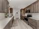 Open concept kitchen boasts modern cabinetry and stainless steel appliances at 809 Garland Ave, Nokomis, FL 34275