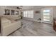 Bright living room with sectional sofa and large windows at 809 Garland Ave, Nokomis, FL 34275