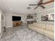Spacious living room featuring a sectional sofa and hardwood floors at 809 Garland Ave, Nokomis, FL 34275