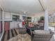 Relaxing patio with seating area, outdoor kitchen, and hot tub at 809 Garland Ave, Nokomis, FL 34275