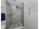 Walk-in shower with gray tile and built-in seating at 809 Garland Ave, Nokomis, FL 34275