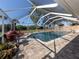Inviting swimming pool with a screened enclosure at 809 Garland Ave, Nokomis, FL 34275