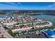 Aerial view of waterfront property with boat slips and community pool at 833 White Cap Cir # 8, Venice, FL 34285