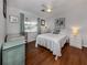 Bedroom with a desk, a queen bed, and hardwood floors at 842 Linden Rd, Venice, FL 34293