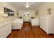 Bedroom with twin beds, wicker furniture, and hardwood floors at 842 Linden Rd, Venice, FL 34293