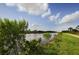 Scenic view of a canal with lush vegetation and a walking path at 842 Linden Rd, Venice, FL 34293