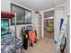 Laundry/storage room with shelving and access to screened porch at 842 Linden Rd, Venice, FL 34293