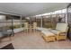 Relaxing screened porch with seating and small table at 842 Linden Rd, Venice, FL 34293