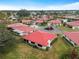Aerial view of community showing multiple homes and a pool at 854 Senda Plata # 22, Venice, FL 34293