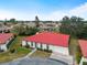 Aerial view of single story home with red tile roof in a community setting at 854 Senda Plata # 22, Venice, FL 34293