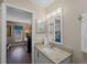 Bathroom with granite vanity and view into bedroom at 854 Senda Plata # 22, Venice, FL 34293