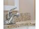 Close-up of a bathroom sink with chrome faucet and granite countertop at 854 Senda Plata # 22, Venice, FL 34293