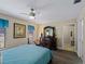 Bright bedroom with a ceiling fan and dresser at 854 Senda Plata # 22, Venice, FL 34293